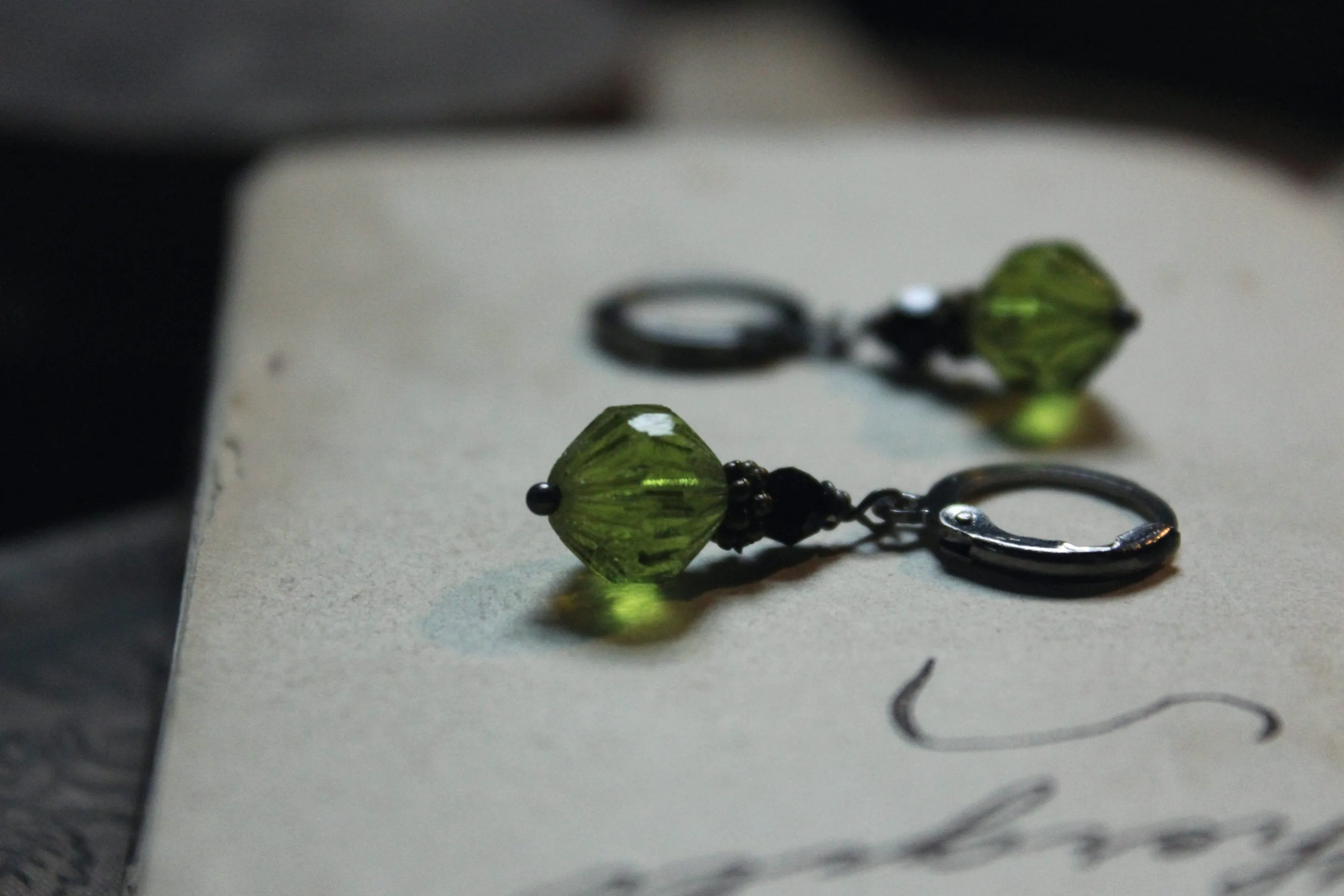 Potion. Faceted Olivine & Jet Black Glass Drop Earrings.