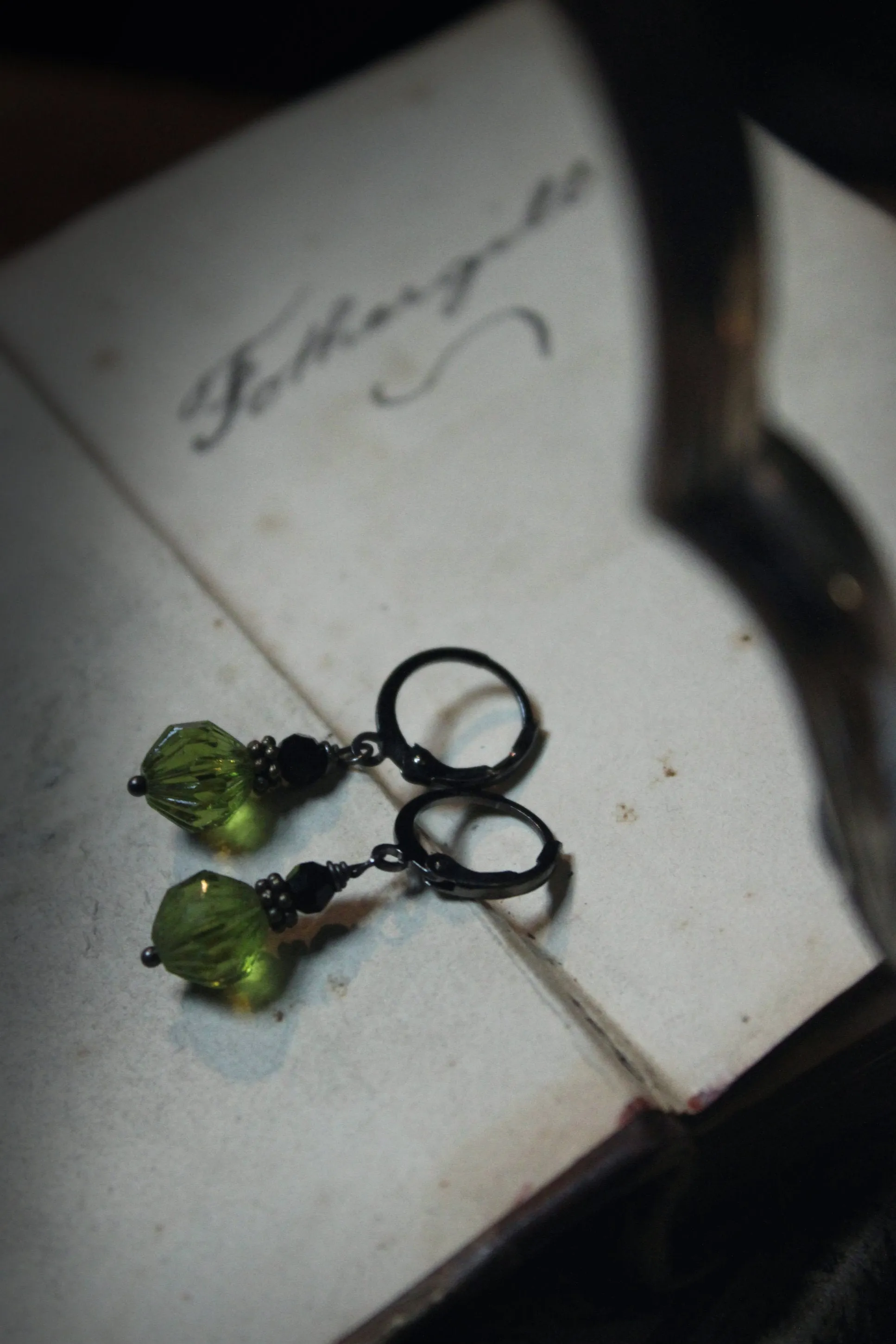 Potion. Faceted Olivine & Jet Black Glass Drop Earrings.